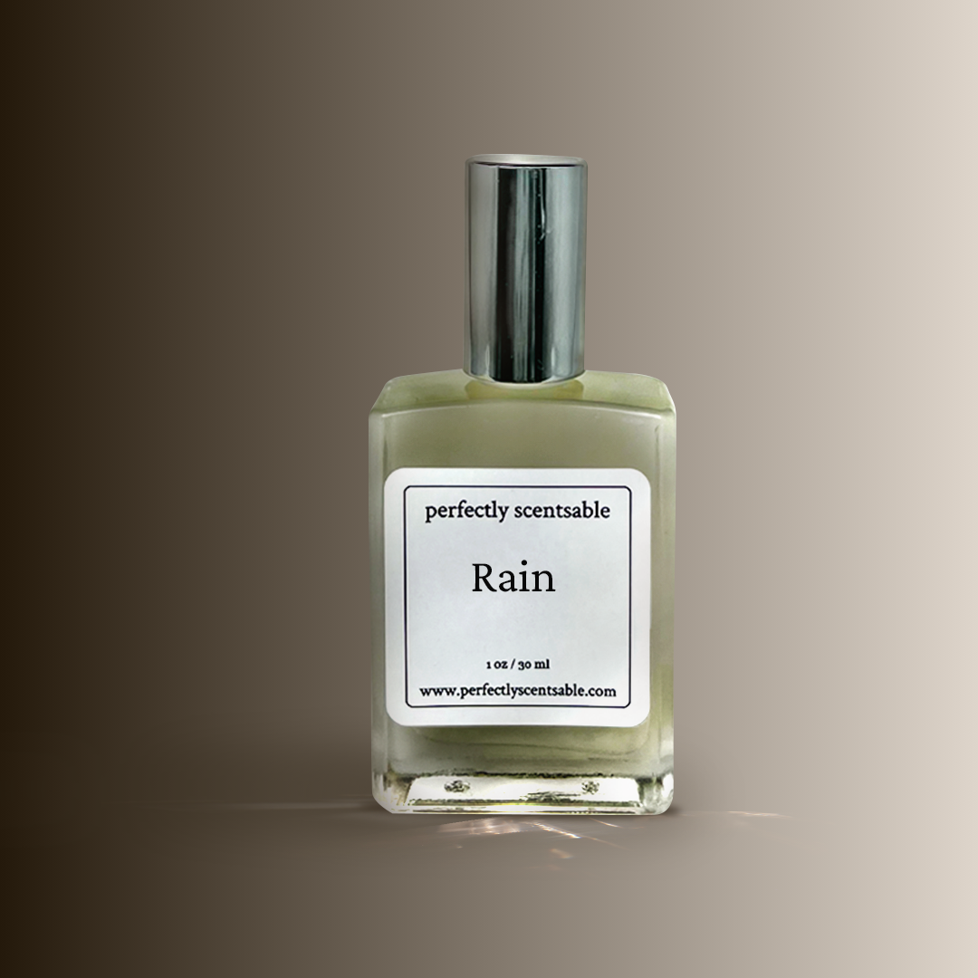 A 1oz perfume oil square glass bottle labeled Rain by Perfectly Scentsable with a silver cap.