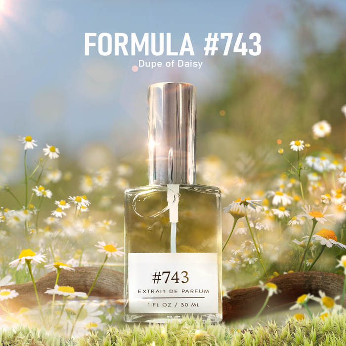 Formula #743 Extrait de Parfum (Dupe of Daisy) bottle standing in a sunlit meadow of white daisies, close-up, 1 fl oz / 30 ml.