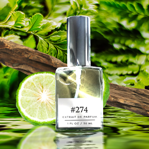Perfectly Scentsable #274 extrait de parfum — silver-capped bottle with bergamot slice, woody branch, and lush green leaves reflected on water
