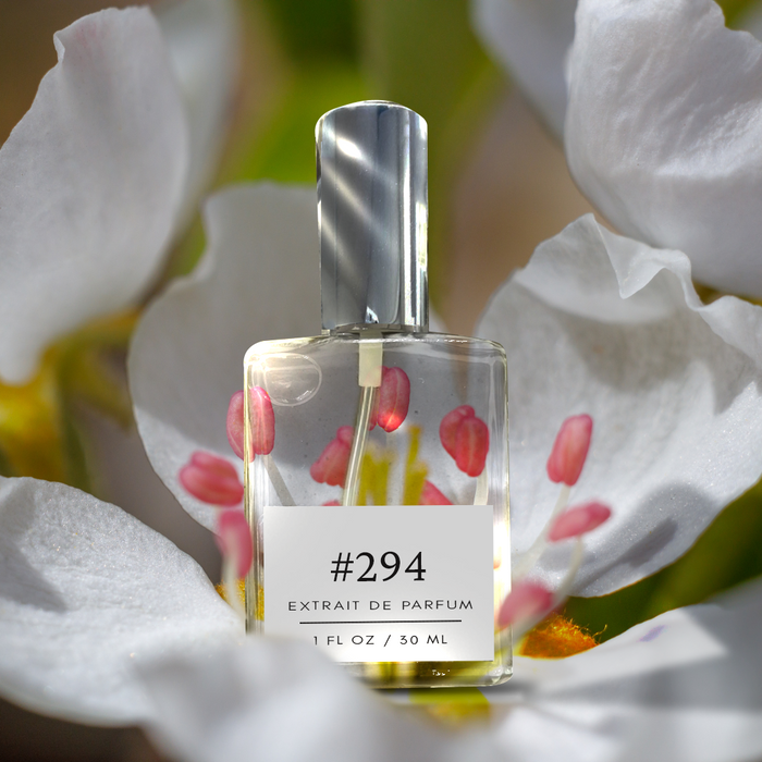 Perfectly Scentsable #294 extrait de parfum — silver-capped bottle set within a white blossom (nashi/pear) with pink stamens