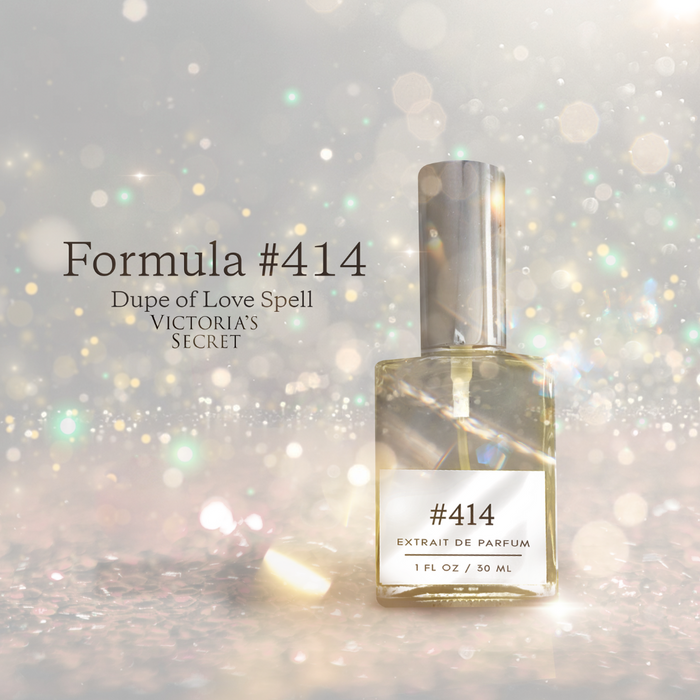 Formula #414 — dupe of Love Spell — extrait de parfum bottle with silver cap against a sparkly bokeh backdrop