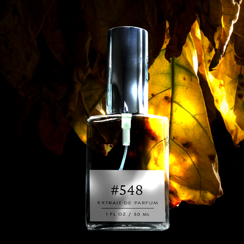 Perfectly Scentsable #548 extrait de parfum — silver-capped 1 fl oz (30 ml) bottle against backlit golden leaves on a dark background