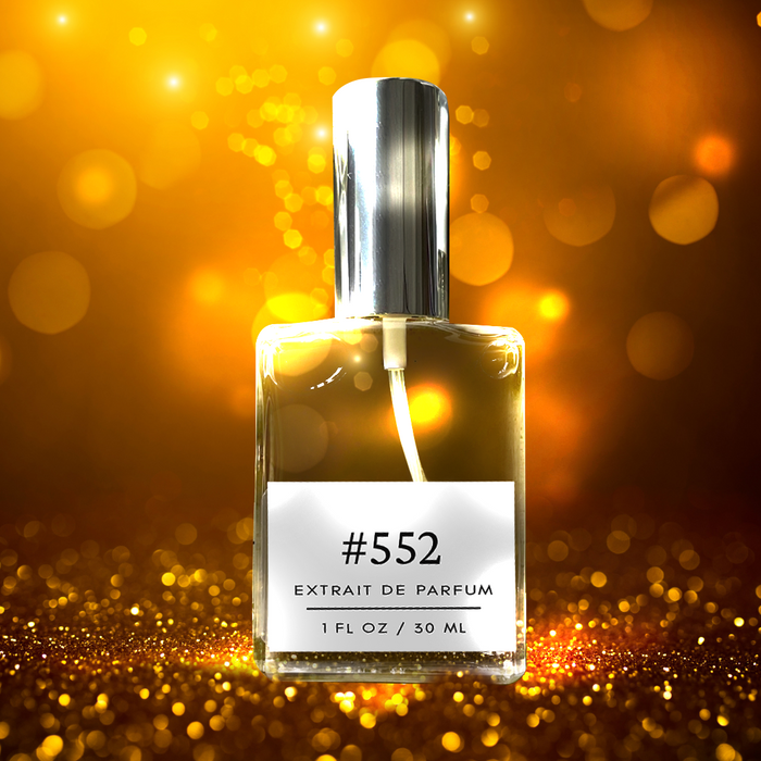 Perfectly Scentsable #552 extrait de parfum — silver-capped bottle against a golden bokeh sparkle background