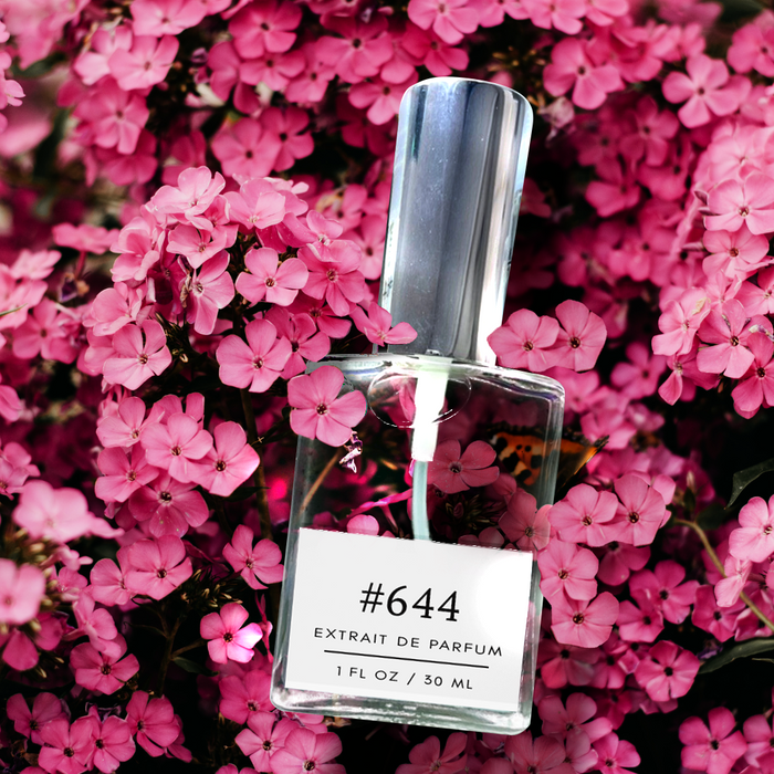 Perfectly Scentsable #644 extrait de parfum bottle (1 fl oz/30 ml) with a silver cap nestled in a dense bed of bright pink blossoms, floral-themed product image.