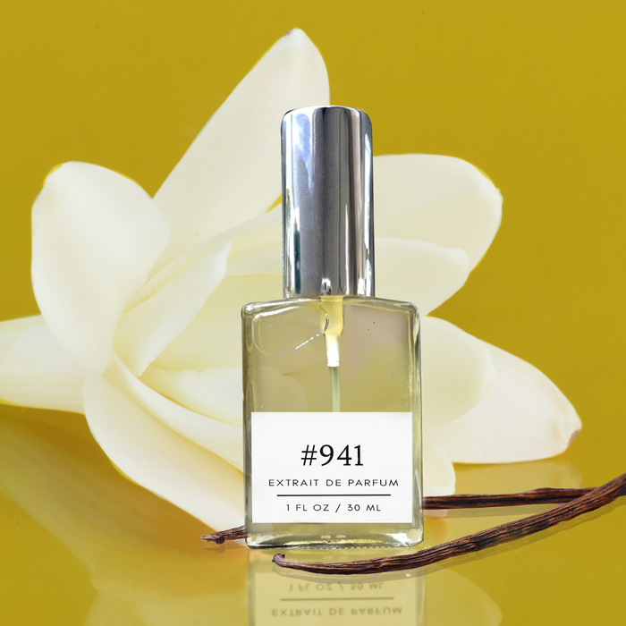 Formula #941 extrait de parfum bottle with a white tropical flower and vanilla bean pods on a warm golden background.