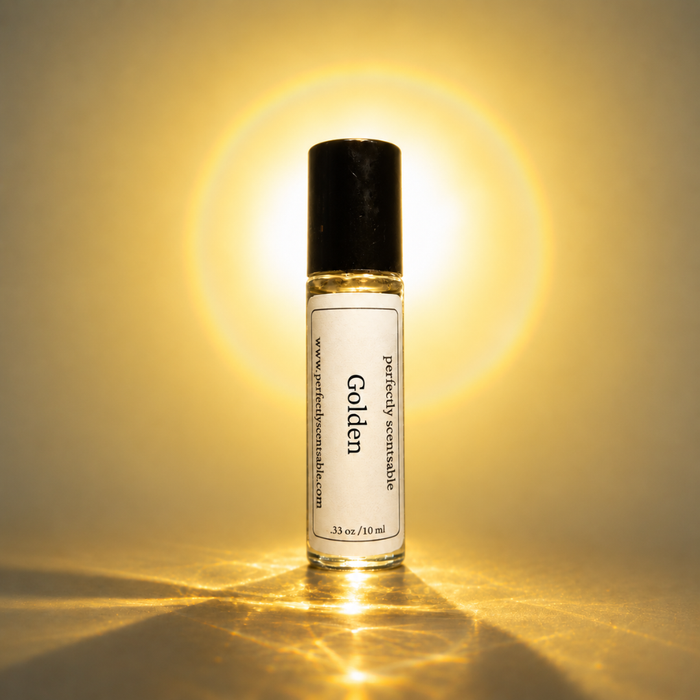 Golden roll-on perfume bottle centered against a glowing golden-yellow background, illuminated from behind with a bright halo effect and warm reflections across the surface.