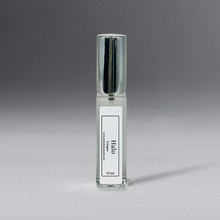 Load image into Gallery viewer, Clear 10 ml oil bottle in a rectangular shape with a silver cap, elegantly standing against a gray background.
