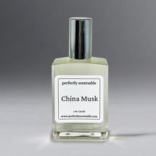 Load image into Gallery viewer, Clear 1 oz oil bottle with silver cap standing against a gray background.
