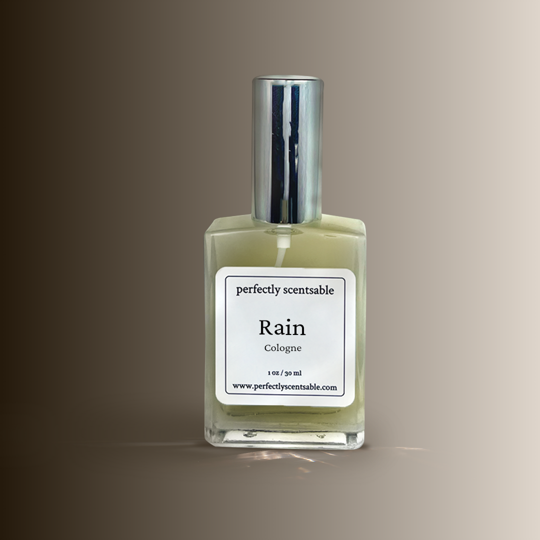 Perfume bottle labeled 'Rain' by 'perfectly scentsable' on a gradient background