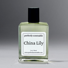 Load image into Gallery viewer, Clear 2 oz oil bottle with black cap, standing against a gray background.
