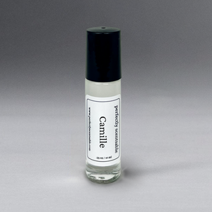Clear 0.33 oz roller bottle with lid, elegantly standing against a gray background.