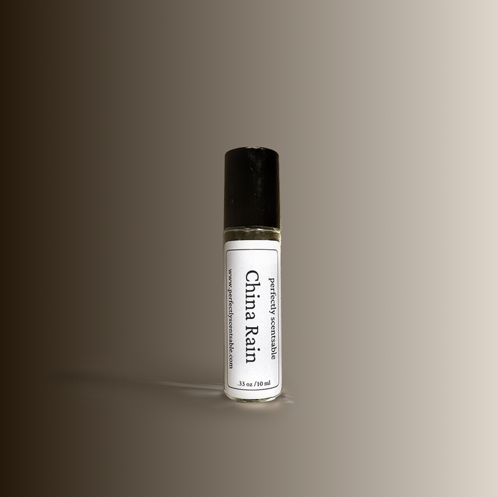 Roll-on bottle labeled 'China Rain' on a gradient brown background
