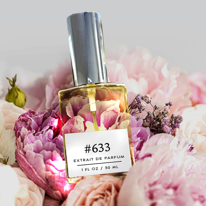 Image of a 1 fl/30 ml bottle of Scent of a Woman fragrance lying down amidst a variety of flowers. The fragrance embodies a captivating blend of Floral-Chypre notes