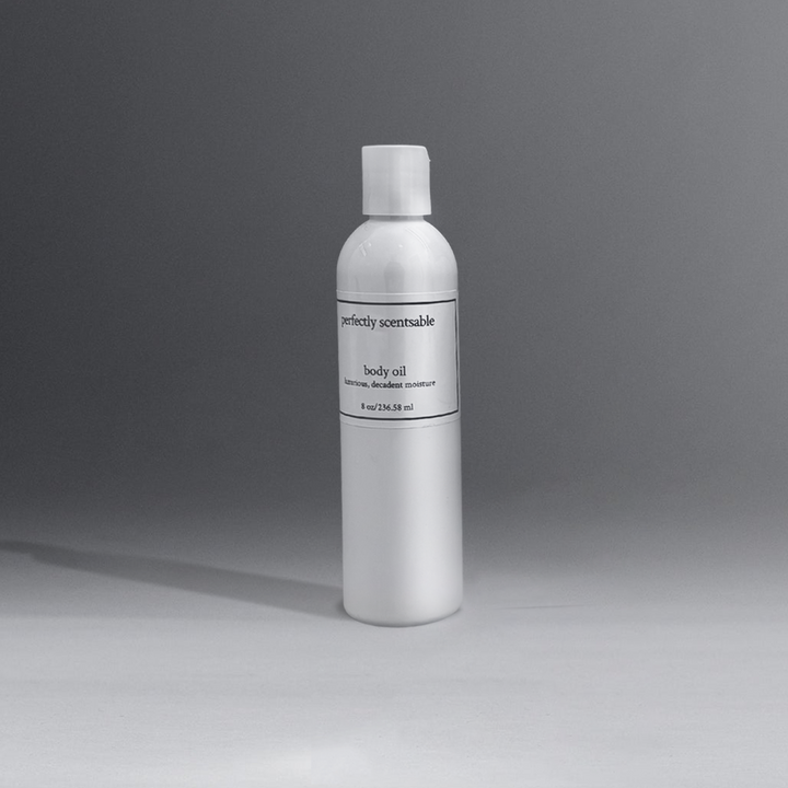 Perfectly Scentsable Body Oil, 8 oz bottle of body oil, set against a sleek gray background.