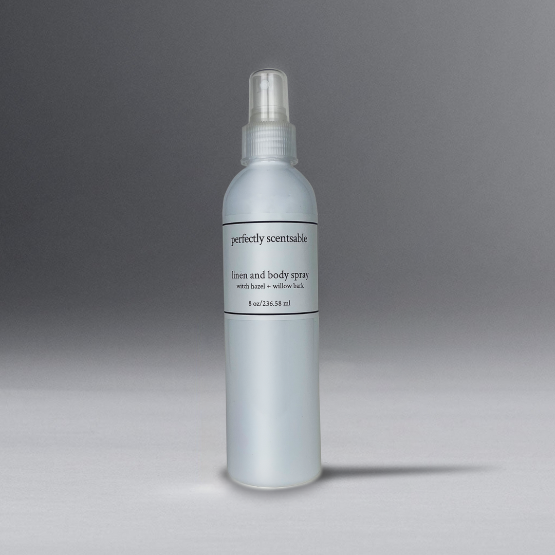 White 8 oz bottle spray standing on a gray background. 