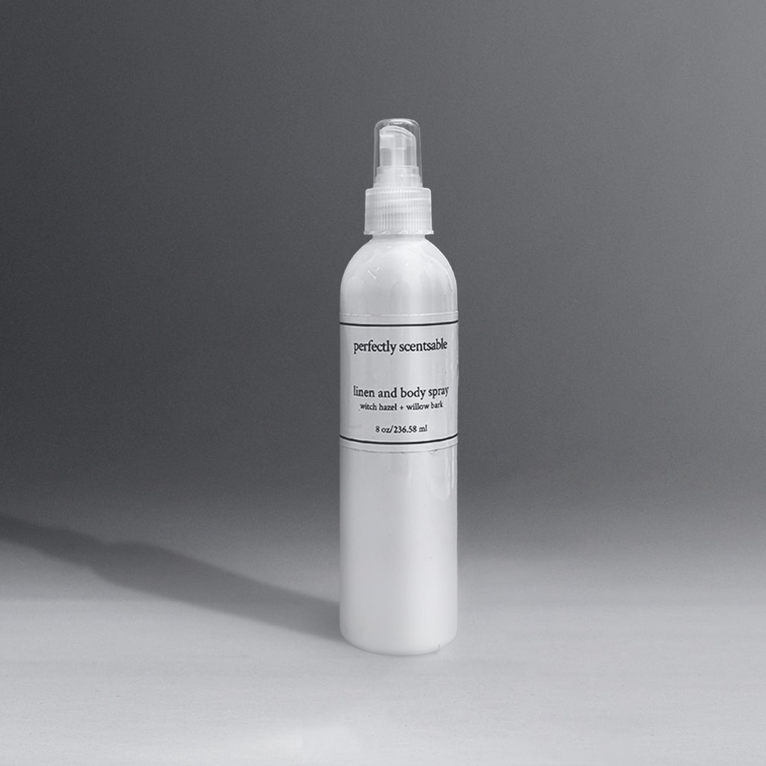 Perfectly Scentsable 8 oz linen and body spray in a white bottle with a spray nozzle, set against a gray background.