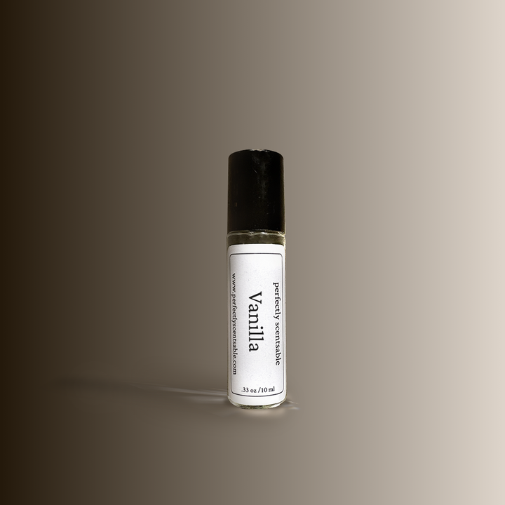 A .33oz rollerbottle labeled Vanilla by Perfectly Scentsable with a dark cap, featuring a .33 oz / 10 ml size label, placed against a smooth brown-to-beige gradient background.