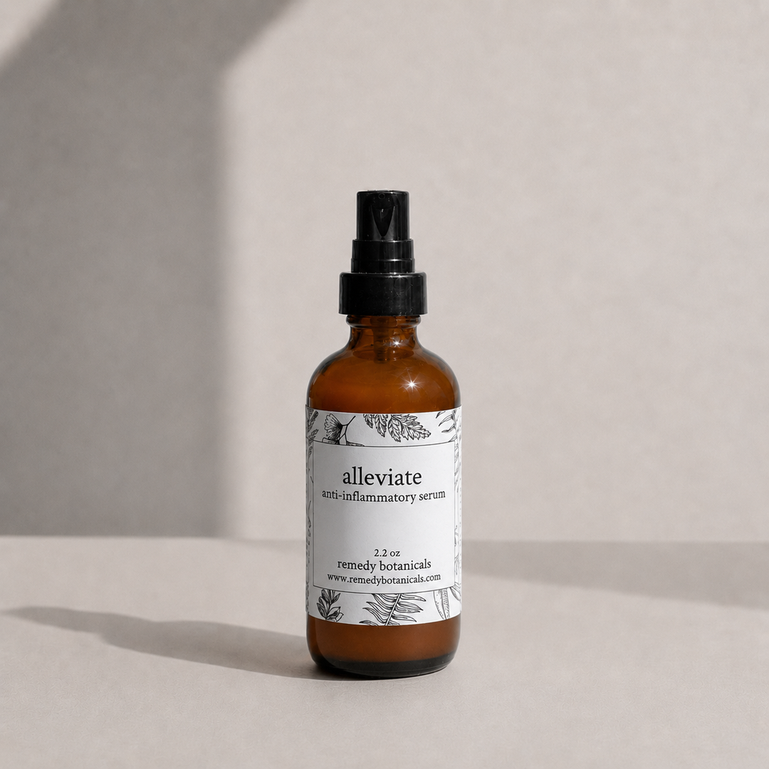 A small amber dropper bottle labeled 'alleviate' by Remedy Botanicals, standing on a light beige surface.