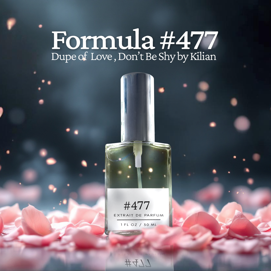 Formula #477 extrait de parfum, a dupe of Love, Don’t Be Shy by Kilian, showcased in a glass bottle with a silver cap, surrounded by soft pink rose petals against a dreamy, glowing background.