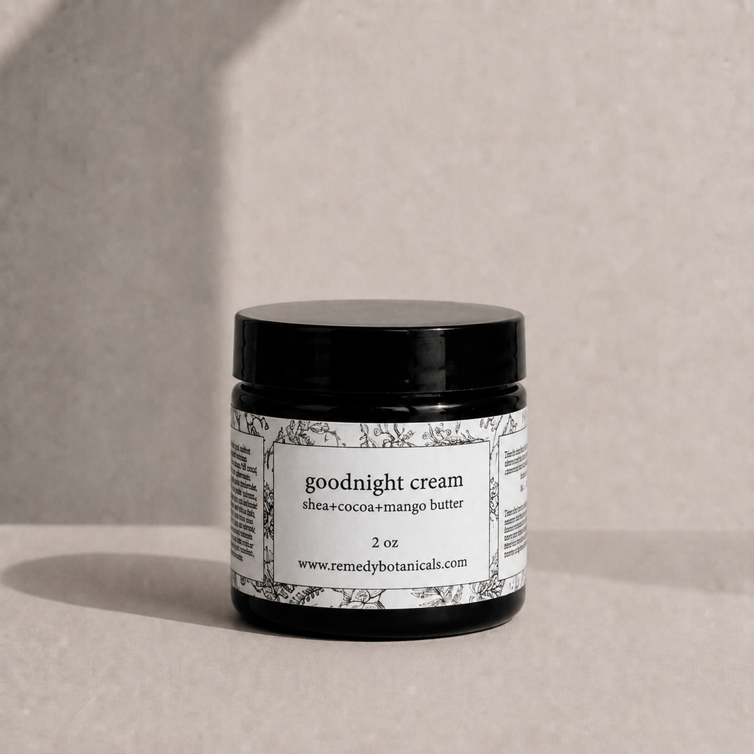 Jar of goodnight cream with a label on a neutral background